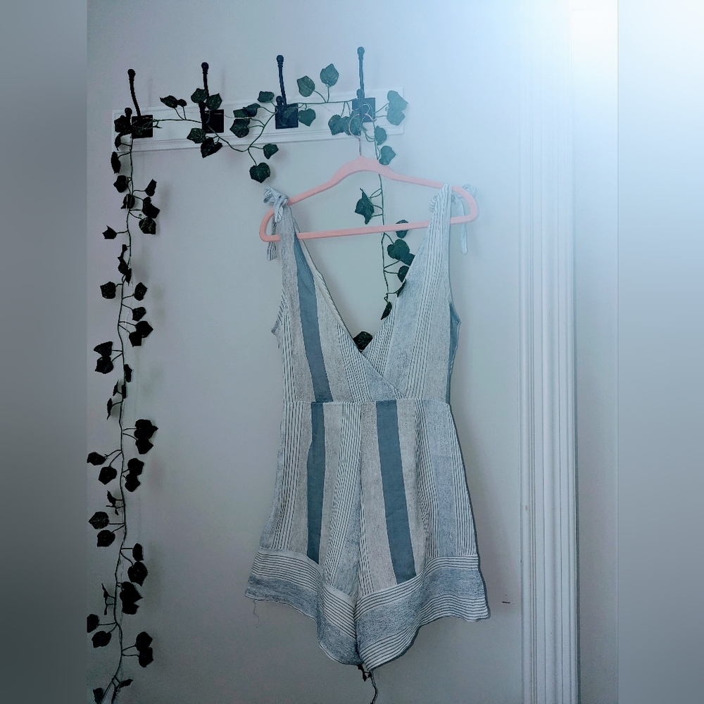 White blue and grey romper in size 4
